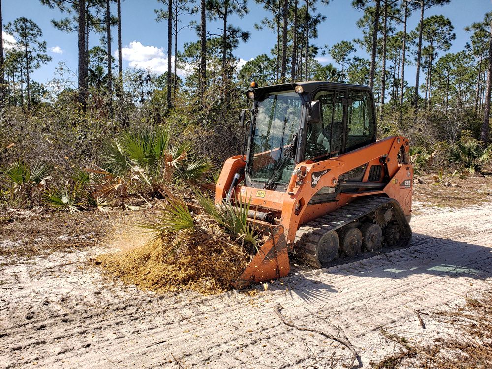 Forestry mulching machine clearing vegetation on an Orlando lot